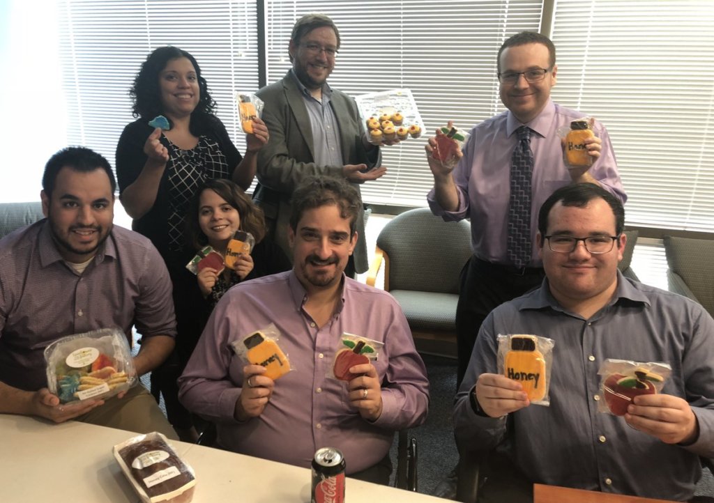 RespectAbility staff and Fellows celebrating Rosh Hashanah with cookies from Sunflower Bakery