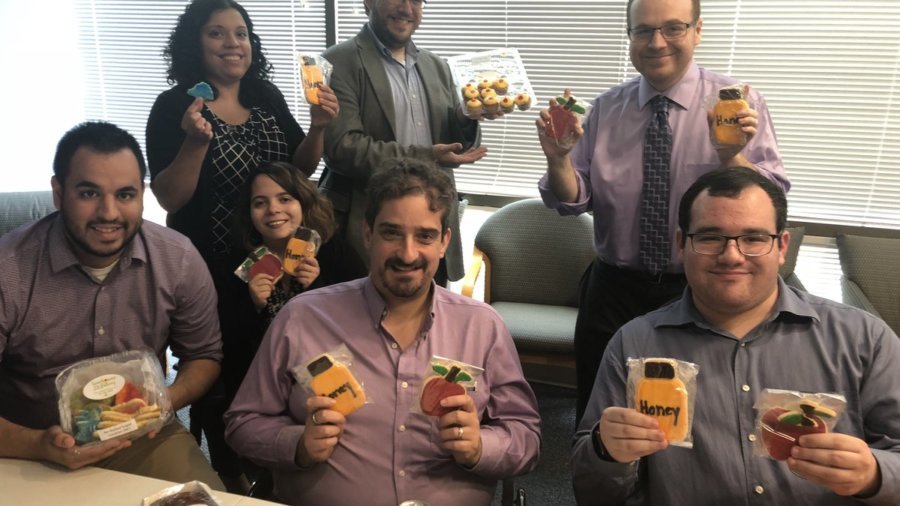 RespectAbility staff and Fellows celebrating Rosh Hashanah with cookies from Sunflower Bakery