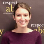 Virginia Campbell smiling in front of the RespectAbility banner