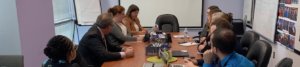 RespectAbility fellows introduce themselves to Andy Imparato at the conference room table