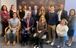 Speakers from the Senate Democratic Diversity Initiative with RespectAbility staff and Fellows in front of the RespectAbility banner