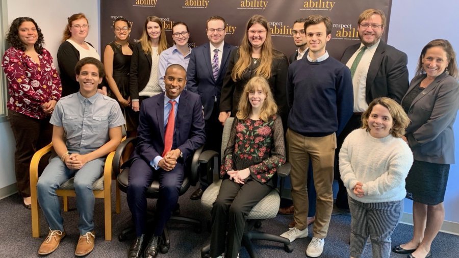 Speakers from the Senate Democratic Diversity Initiative with RespectAbility staff and Fellows in front of the RespectAbility banner