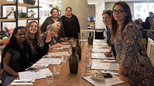 Participants in the Ono Academic College inclusion advocacy program smile at a table