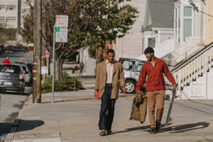 Jimmie Fails and Jonathan Majors walking down a sidewalk