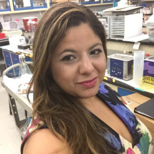 Kaliris Salas-Ramirez smiling in a lab classroom