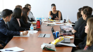 Donna Walton speaking with RespectAbility Fellows around the conference room table