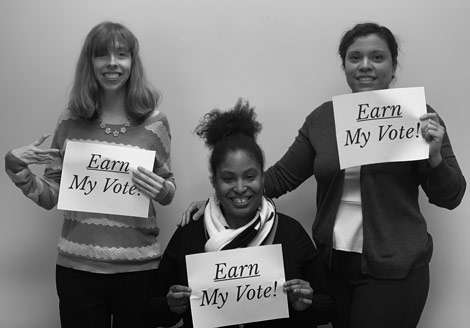 Earn My Vote - Three Women Holding Signs