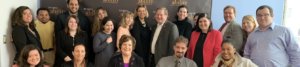 Linda Burger with RespectAbility staff and Fellows in front of the RespectAbility banner