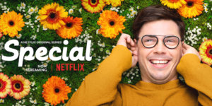 Ryan O'Connell smiling lying in a field of flowers. Logo for Special. Text: A Netflix Original Series Now Streaming. Netflix logo
