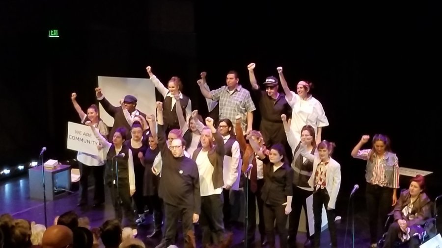 23 cast members, most who have Autism, singing on stage