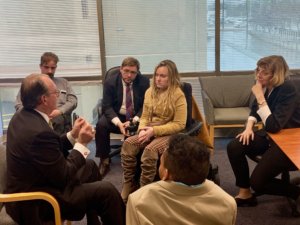 Neil Romano talking with RespectAbility staff and Fellows in a small group after his main talk