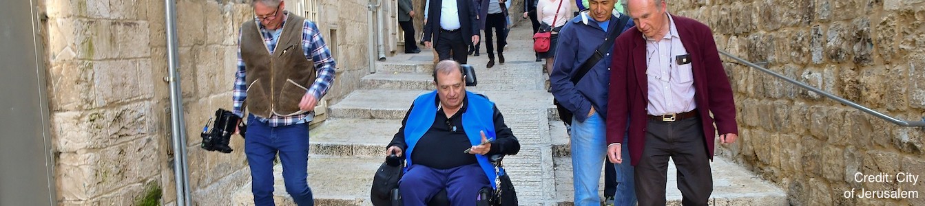 A wheelchair user tries out the newly accessible streets in Jerusalem's Old City, part of a NIS 20 million ($5.5 million) project along four kilometers of Old City streets