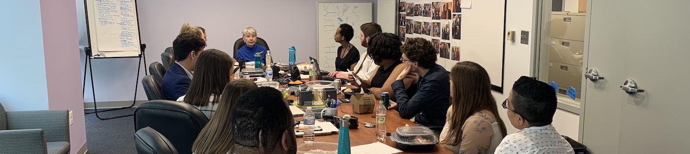 Eleanor Clift with RespectAbility Fellows sitting at the conference room table