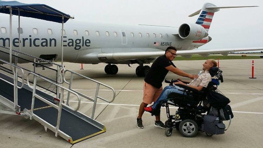 Lenny Larsen and his primary LVN Carlos Lopez outside an airplane smiling at each other