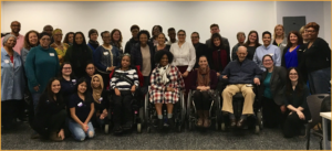 Attendees at training for mothers of students with disabilities smiling together