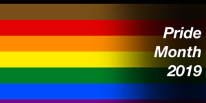 Pride flag with all colors of rainbow including black and brown. Text: Pride Month 2019