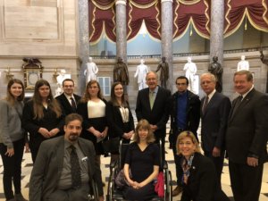 Co-authors of the ADA with RespectAbility Fellows and staff, smiling together inside the US Capitol Dome