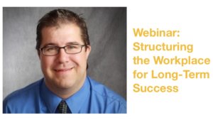 James Emmett smiling wearing a blue shirt and glasses in front of a grey backdrop. Text: Webinar: Structuring the Workplace for Long-Term Success