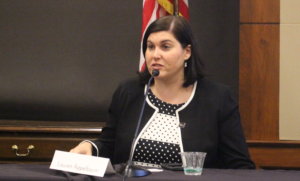 Lauren Appelbaum speaking on RespectAbility's final panel, sitting at a table behind a microphone