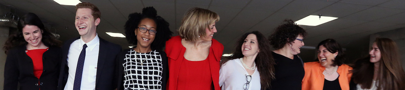 RespectAbility Jewish staff and Fellows smile together with their arms around each other