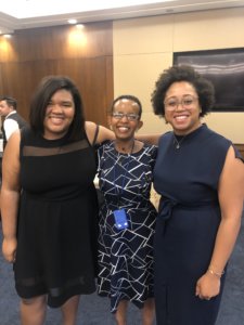 Angelica Vega, Laka Mitiku Negassa and Evelyn Kelley smiling with their arms around each other at RespectAbility's Summit