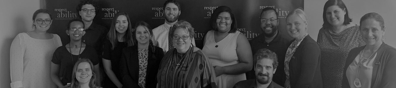 RespectAbility Summer 2019 Fellows, Staff, and guest speaker Celinda Lake smiling in front of the RespectAbility banner