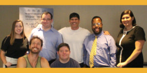 Jolie Carr with RespectAbility team members and the directors and star of the Peanut Butter Falcon in front of a poster for the movie