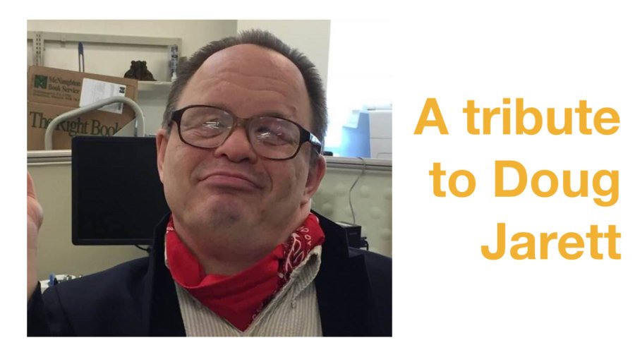 Doug Jarett smiling wearing a red bandana around his neck. Text: A tribute to Doug Jarett