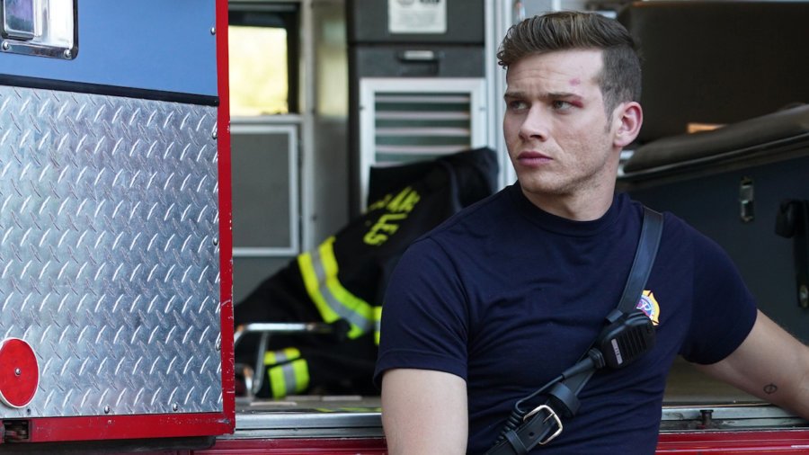 Oliver Stark on 9-1-1 sitting by a firetruck