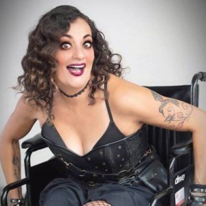 Filmmaker Diana Romero In A Wheelchair Dressed In All Black