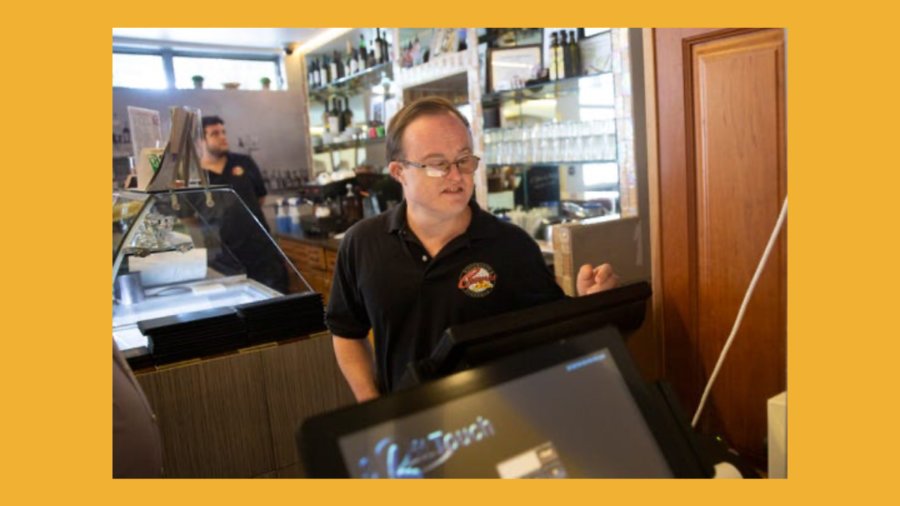 Cosmos Ristorante & Pizzeria employee Shawn Denton clocks in before the start of his work shift, Thursday, Sept. 19, 2019 in Naples.