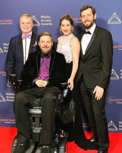 John Lawson, Tobias Forest, Kelli McNeil and Alexander Yellin smile together on the red carpet at the Media Access Awards