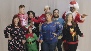 The cast of Born This Way together in festive clothes