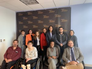 Ash Williams with RespectAbility staff and Fellows in front of the RespectAbility banner