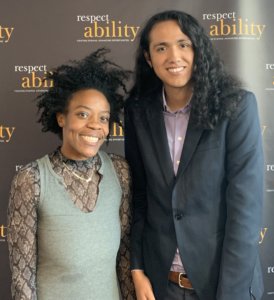 Ash Williams and Bruno Medina smile in front of the RespectAbility banner