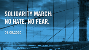 Blue and black photo of the Brooklyn Bridge. Text: Solidarity March. No Hate. No Fear. 01.05.2020