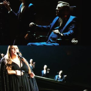 Tobias Forrest and Victoria Canal performing in a choir with Chrissy Metz on stage at the Academy awards