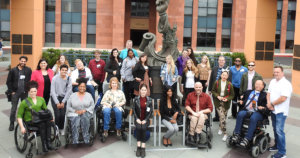 diverse group of summer lab participants with disabilities posing for photo on Walt Disney lot