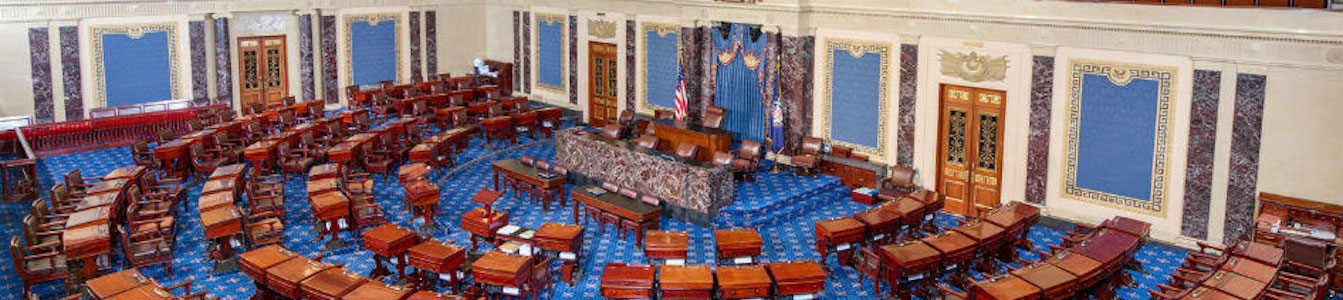 The U.S. Senate chamber, empty, from above.