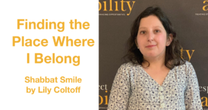 Lily Coltoff smiling in front of the RespectAbility banner. Text: Finding the Place Where I Belong Shabbat Smile by Lily Coltoff
