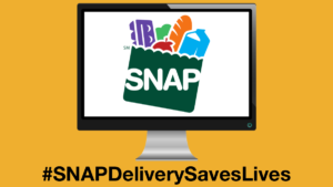 The SNAP logo displayed on a computer monitor. Text: #SNAPDeliverySavesLives