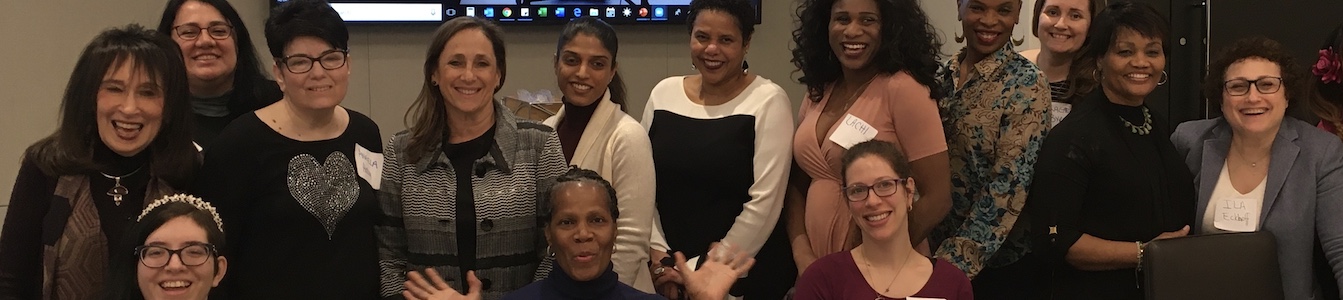 trainees, mentors, and guest allies at a Women and Nonbinary Speakers Bureau: NYC convening smile together