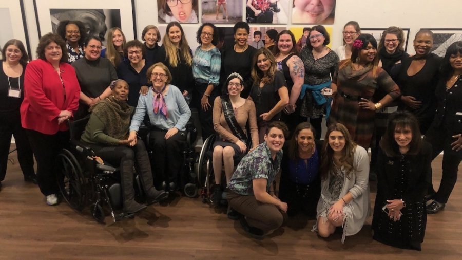 Attendees at the November 2019 launch of Women and Nonbinary Speakers Bureau: NYC at Positive Exposure smile together