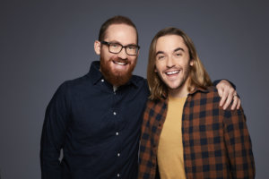 Shane Houghton and Chris Houghton smiling with their arms around each other