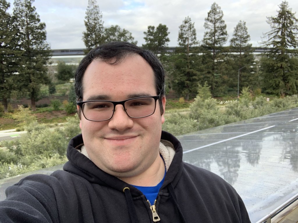 Eric Ascher smiles taking a selfie at Apple Park's visitor center