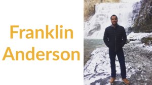 Franklin Anderson smiling, standing in front of a waterfall. Text: Franklin Anderson