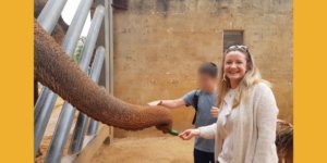 Rachael Risby Raz feeding an elephant at the Tisch Family Biblical Zoo