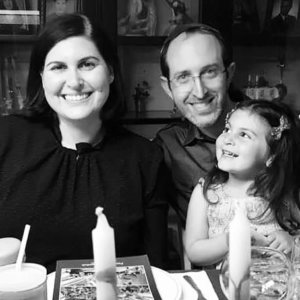 Lauren Appelbaum with her husband and daughter celebrating Passover