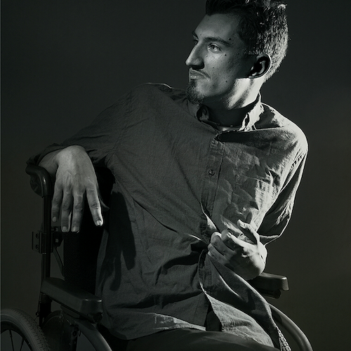 Andrew Pilkington portrait with him using a wheelchair