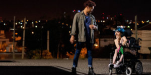 Two people talk at night, including a woman who is using a wheelchair, in a still from 4 Feet High by María Belén Poncio and Rosario Perazolo Masjoan, an official selection of the Indie Series Program at the 2021 Sundance Film Festival.